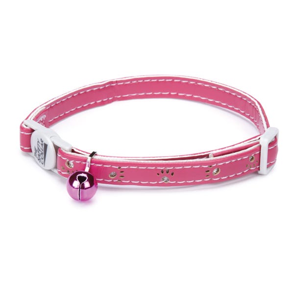 Pink cat collar with white stitching, paw print cutouts, and a silver bell.