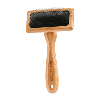 Small slicker brush with bamboo handle and metal bristles for pets.