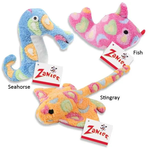Three plush dog toys: a blue seahorse, a pink fish, and an orange stingray, all with colorful polka dots.